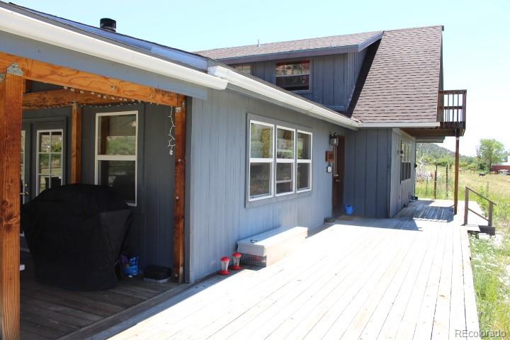 17075 County Road 220 Salida, CO 81201 - Photo 18 of 18 a bedroom with a bed and wooden floor