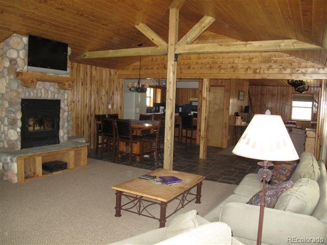 17075 County Road 220 Salida, CO 81201 - Photo 6 of 18 a living room with furniture and a fireplace