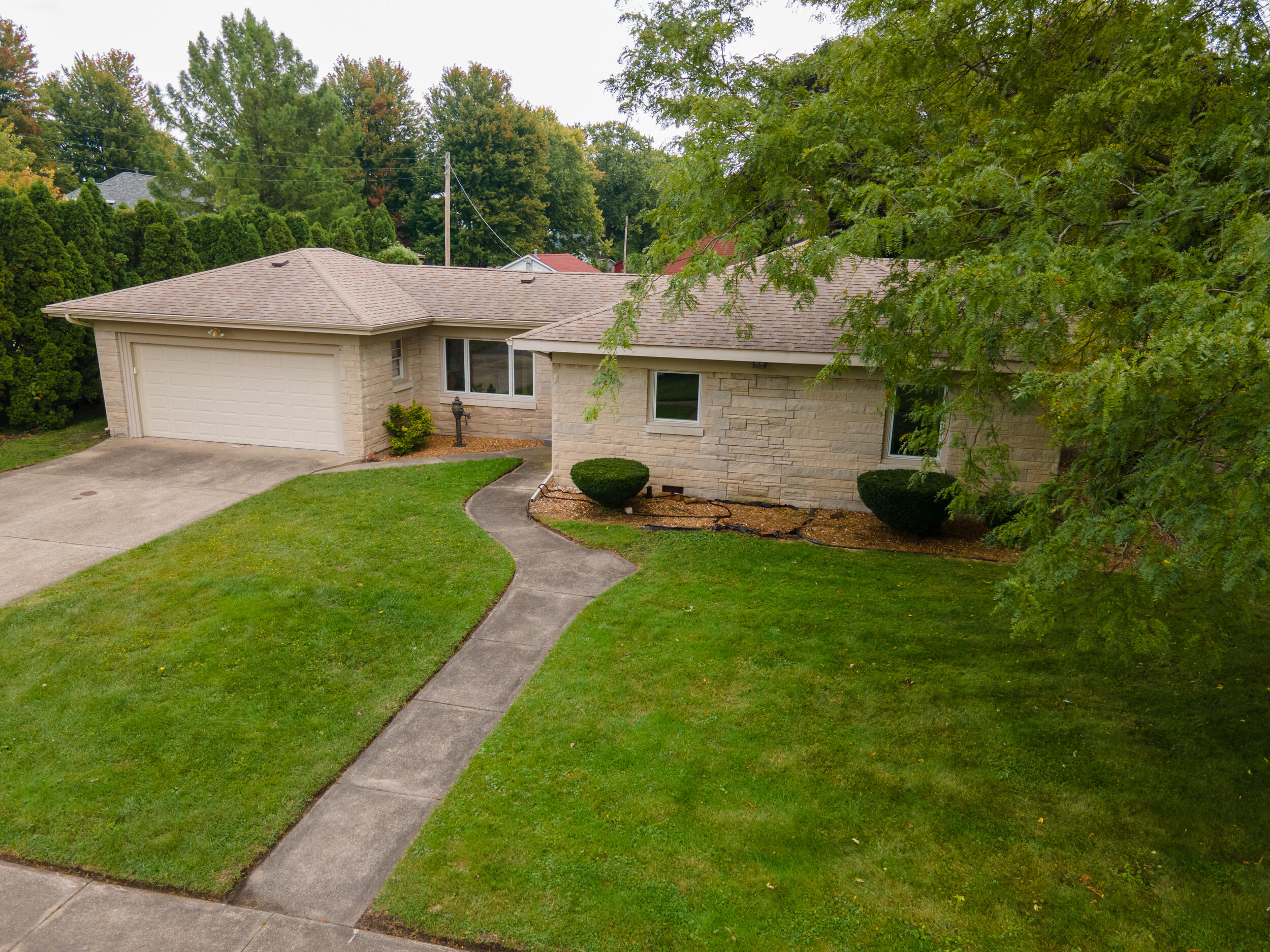 601 East Main Street La Crosse, IN 46348 - Photo 1 of 29 a front view of a house with a garden