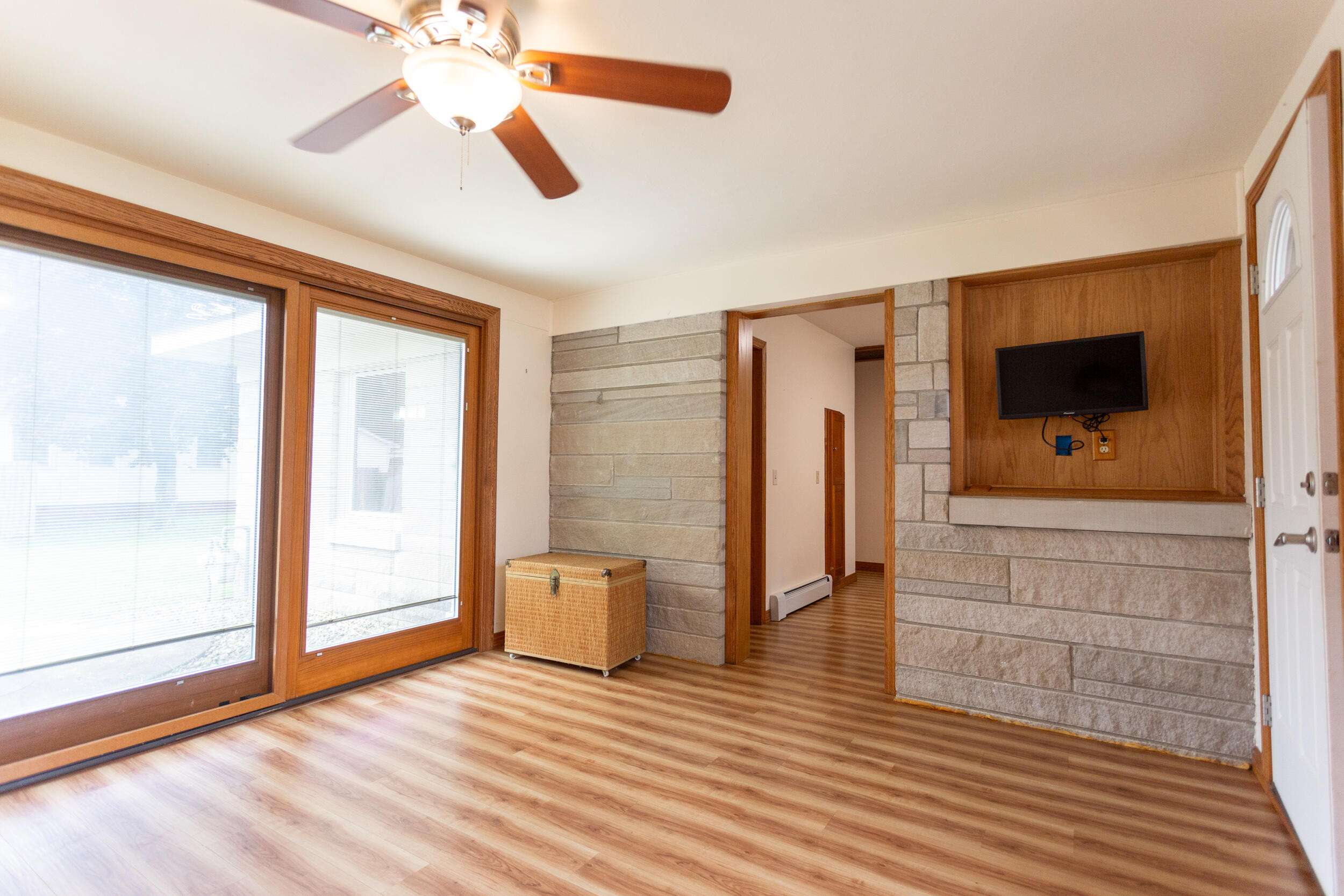 601 East Main Street La Crosse, IN 46348 - Photo 14 of 29 a view of empty room with wooden floor and fan