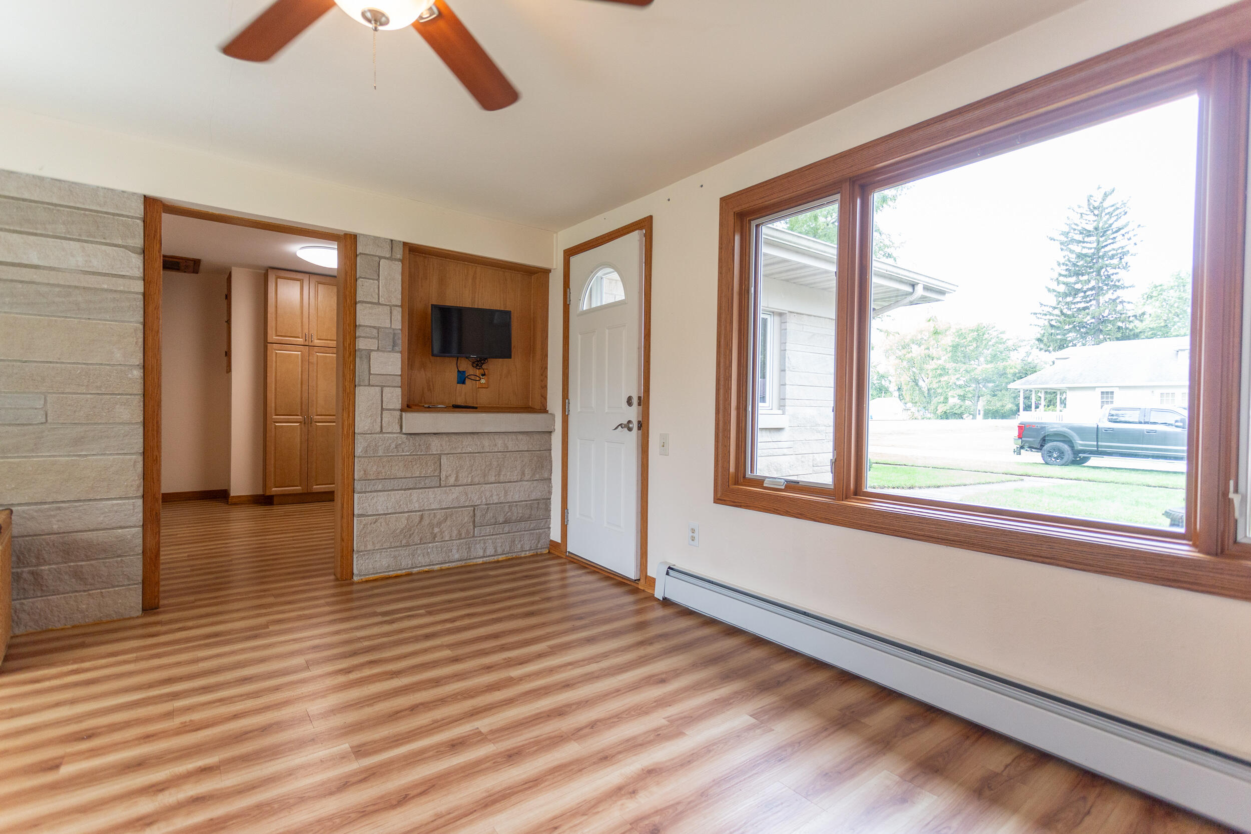 601 East Main Street La Crosse, IN 46348 - Photo 15 of 29 wooden floor in an empty room with a window