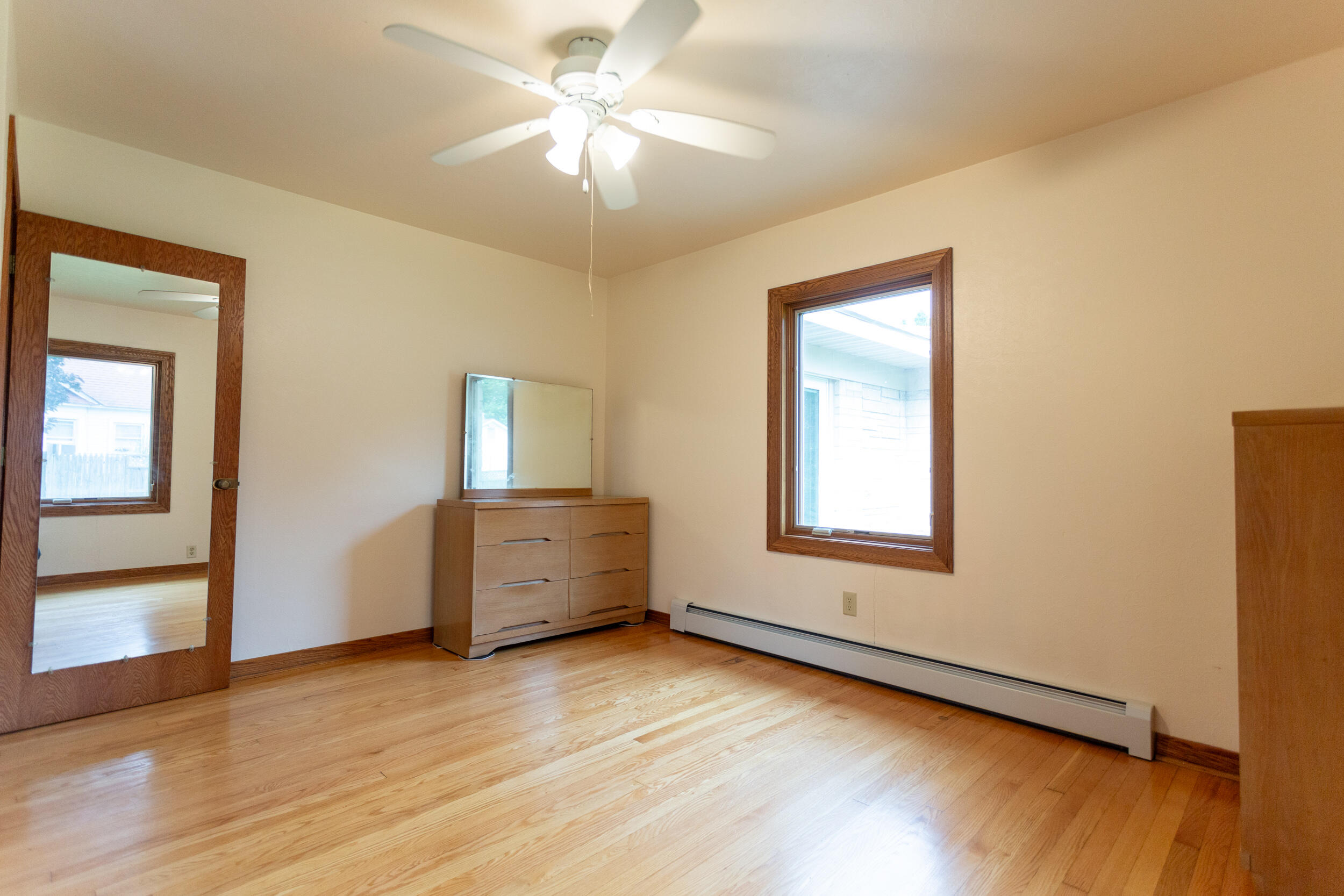 601 East Main Street La Crosse, IN 46348 - Photo 18 of 29 a view of an empty room with wooden floor and a window