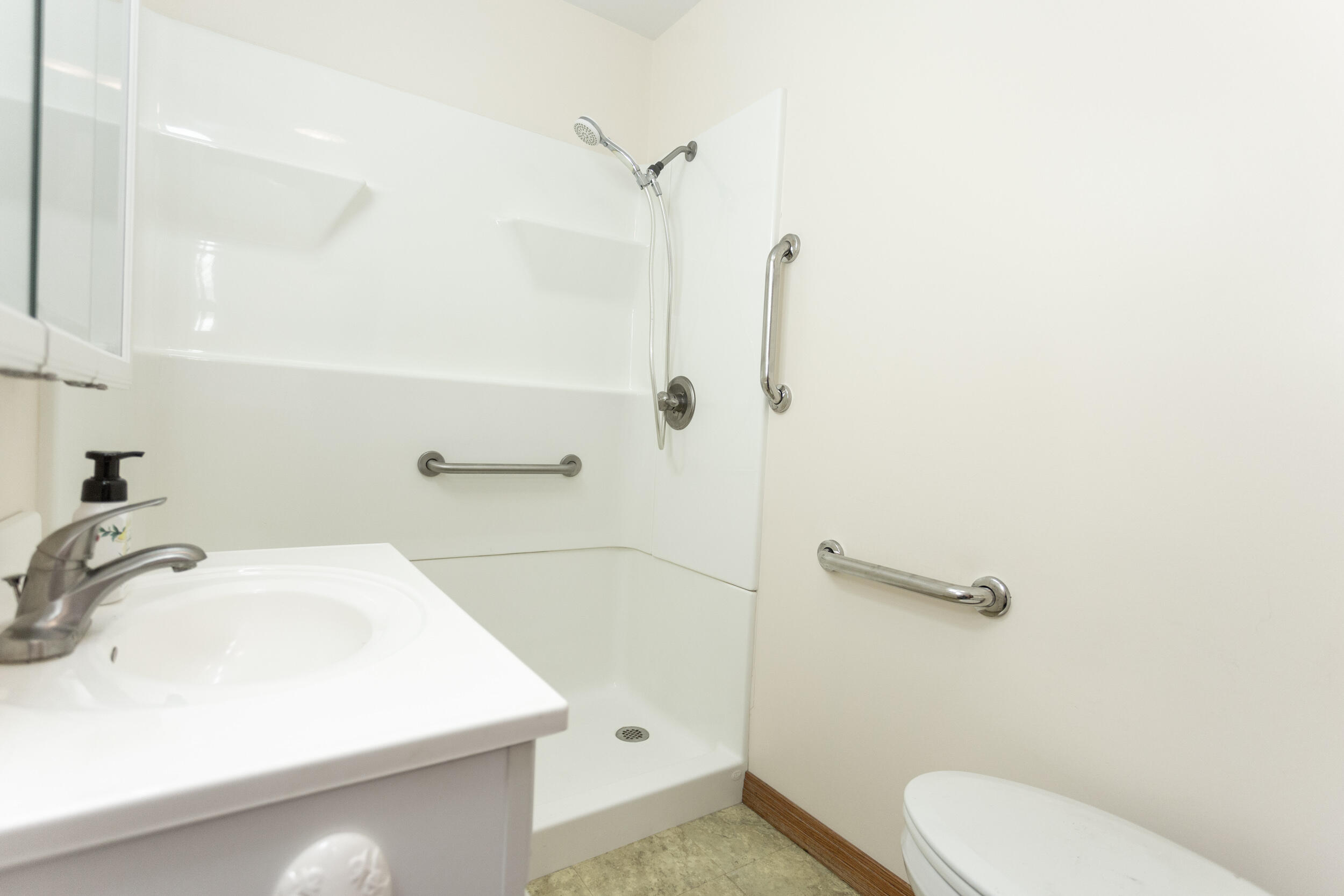 601 East Main Street La Crosse, IN 46348 - Photo 22 of 29 a bathroom with a sink a toilet and shower