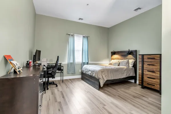 a bedroom with a bed and a closet