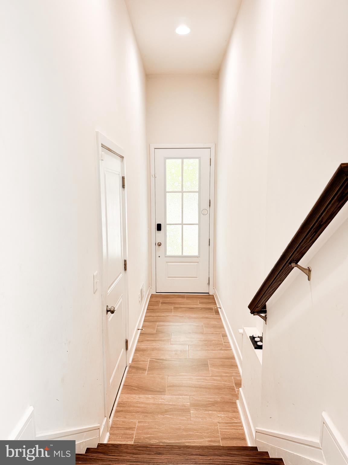 25419 Reed Orchard Terrace Chantilly, VA 20152 - Photo 5 of 47 a view of a hallway with wooden floor and staircase