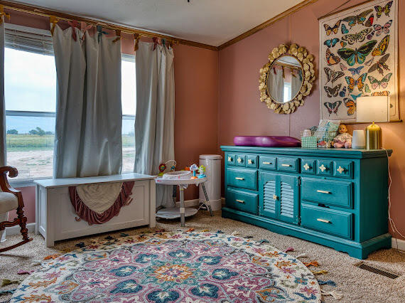 6341 Farm Private Road Levelland, TX 79336 - Photo 24 of 46 a room with toys and a wooden table