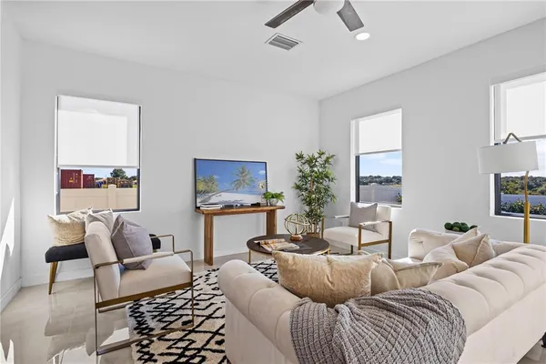 a living room with furniture and a large window