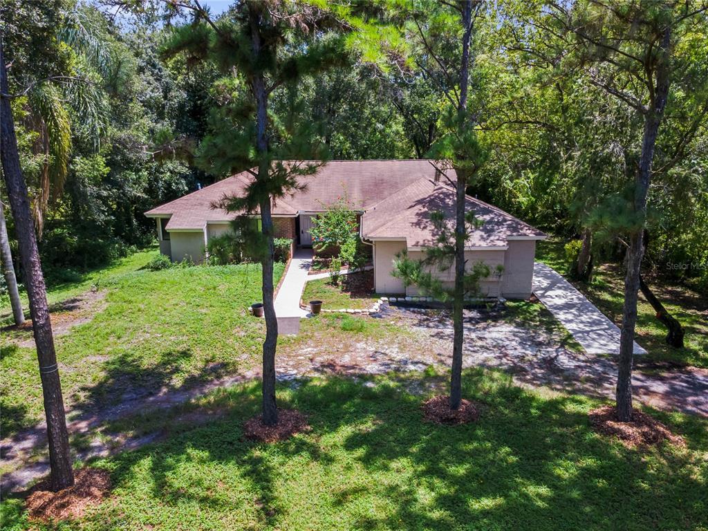 2809 Aein Road Orlando, FL 32817 - Photo 1 of 1 **MUST SEE!** This East Orlando HOME is waiting with an OVERSIZED 1-1/2 ACRE LOT features a NO HOA, a CONVERTED GARAGE and has a NEWER WATER HEATER (2019)!