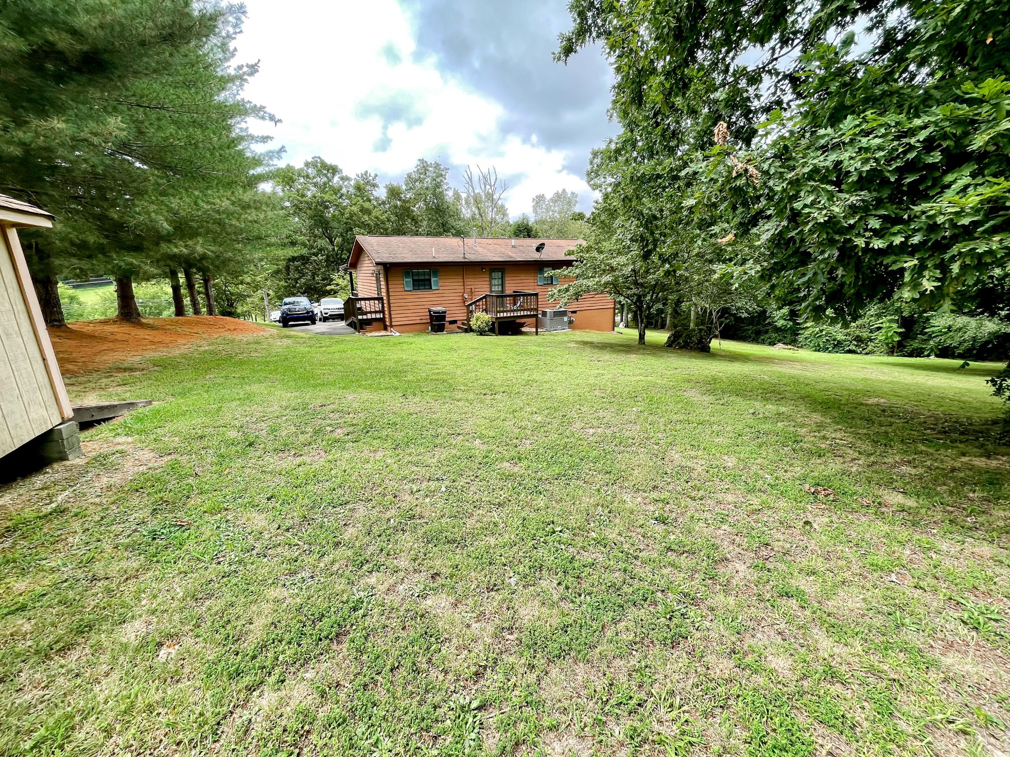4935 Maple Hill Road Loudon, TN 37774 - Photo 4 of 16 a view of an house with backyard space and balcony