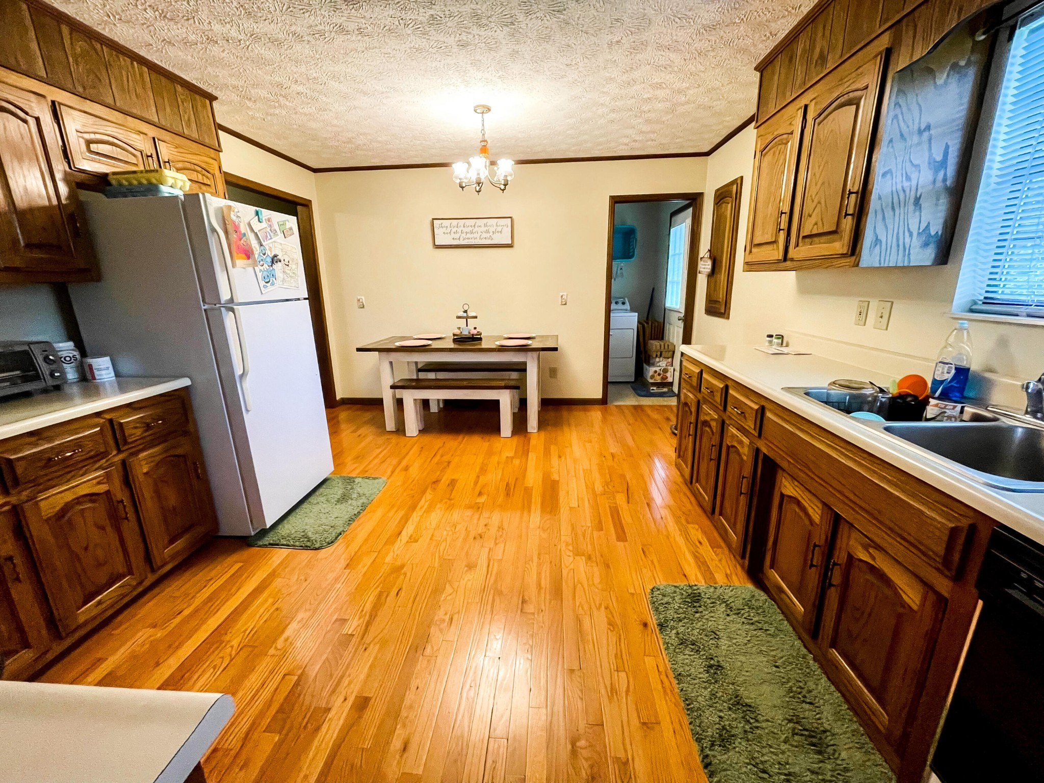 4935 Maple Hill Road Loudon, TN 37774 - Photo 7 of 16 a kitchen with sink a refrigerator and wooden floor
