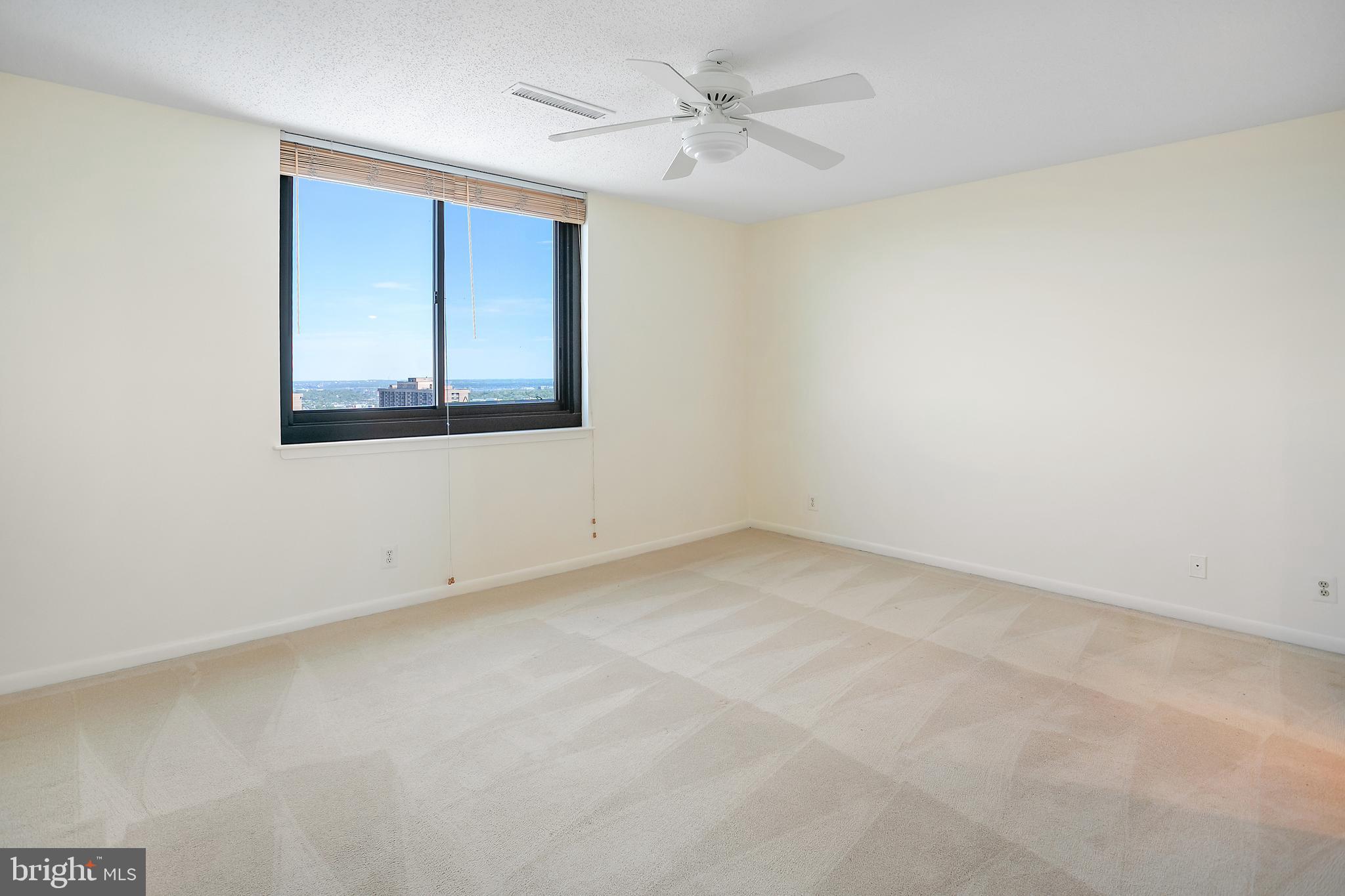 5505 Seminary Road, Unit 2605N Falls Church, VA 22041 - Photo 22 of 53 an empty room with a window and a ceiling fan