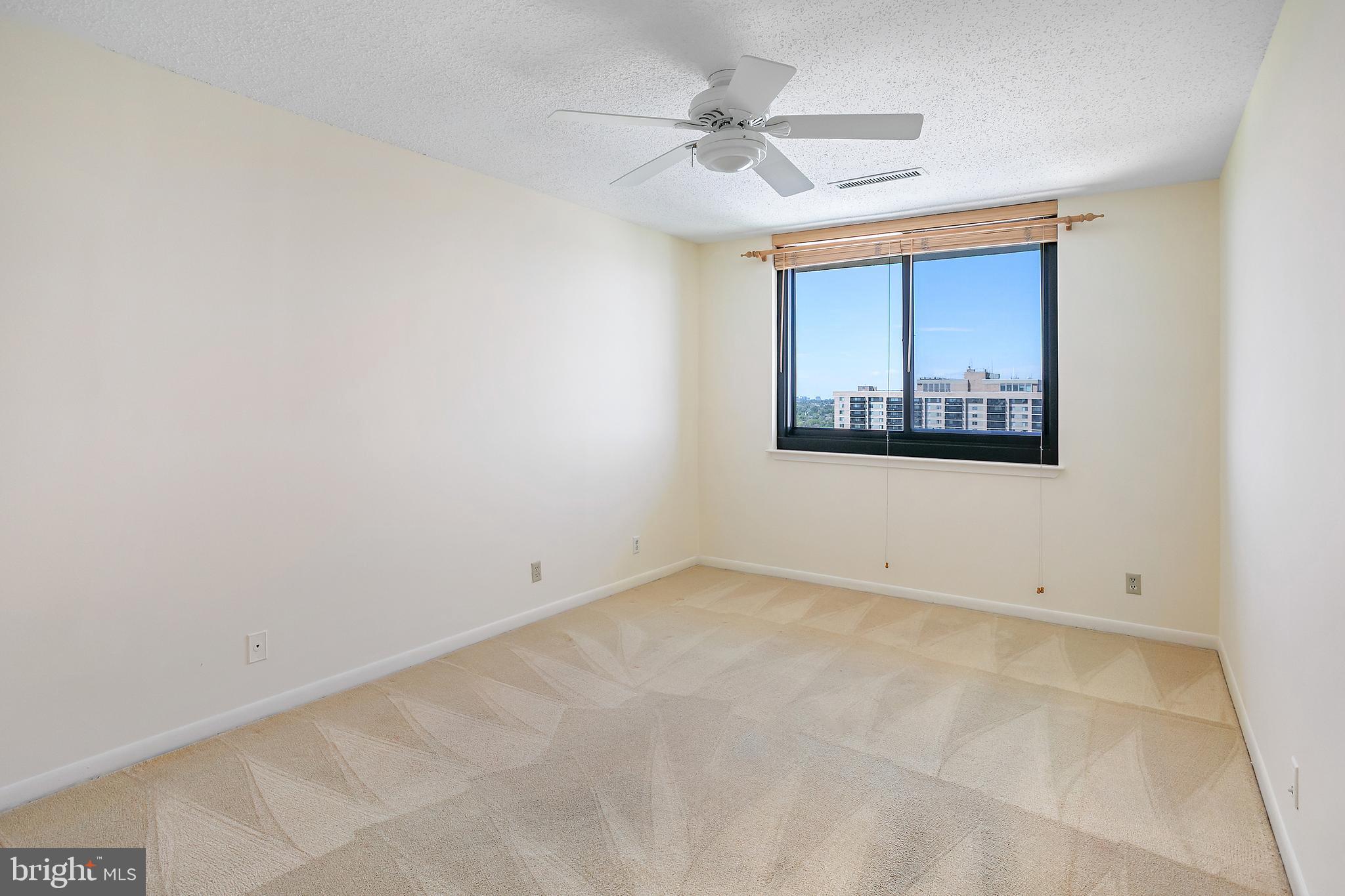 5505 Seminary Road, Unit 2605N Falls Church, VA 22041 - Photo 27 of 53 an empty room with a ceiling fan and a window