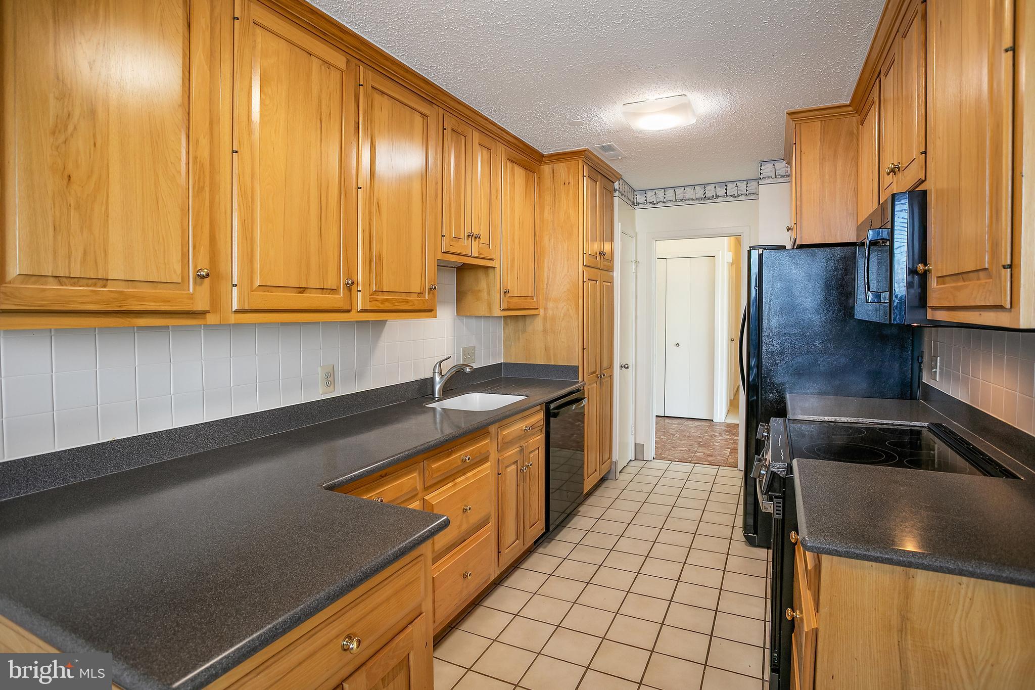 5505 Seminary Road, Unit 2605N Falls Church, VA 22041 - Photo 3 of 53 a kitchen with stainless steel appliances a refrigerator sink and microwave