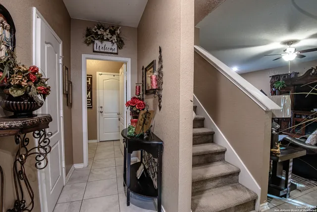 a view of a hallway with wooden floor and a livingroom view