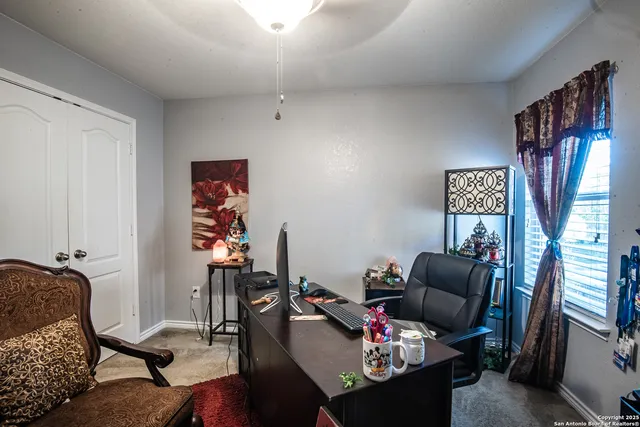 a view of a workspace with furniture and workspace