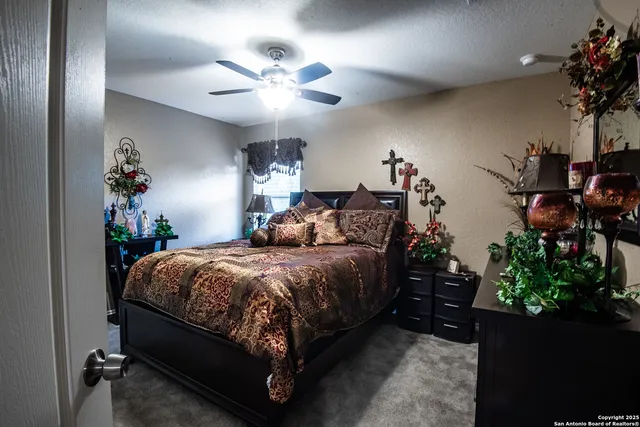 a bed room with a bed and a potted plant