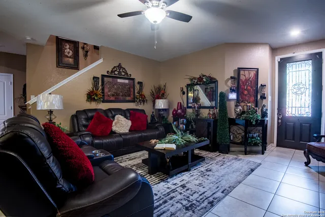 a living room with lots of furniture and a chandelier