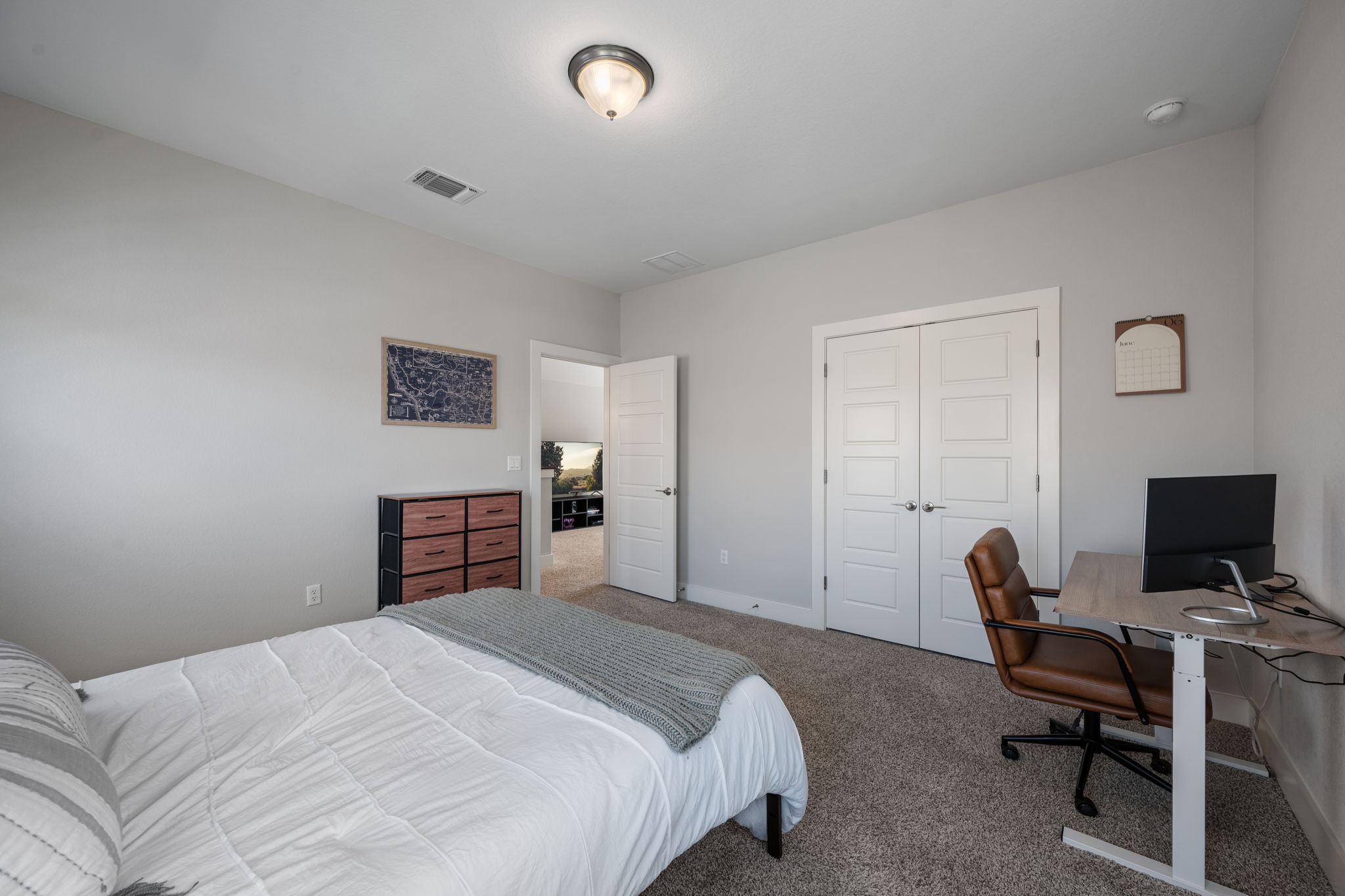 5409 Fox Wing Way Austin, TX 78747 - Photo 18 of 26 A well-appointed bedroom includes ample closet space and plush carpeting.