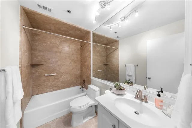 a bathroom with a shower and toilet