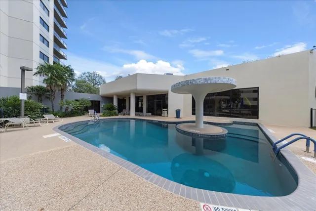 a bathroom with a bathtub shower sink mirror vanity and toilet