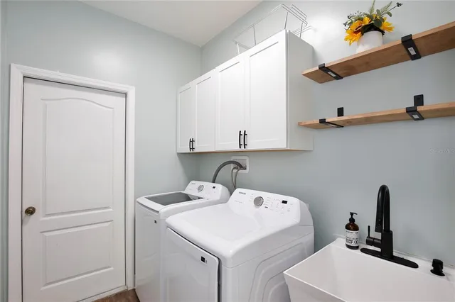 a utility room with dryer and washer