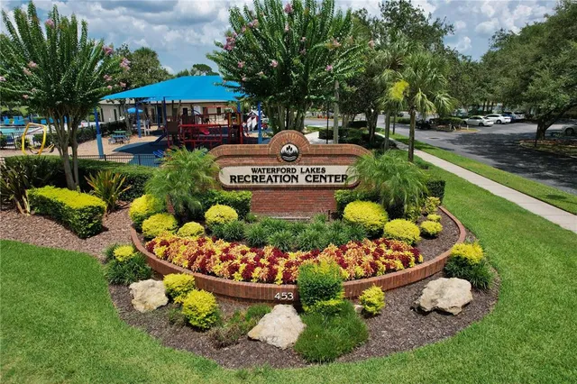 a front view of a house with a yard and outdoor seating