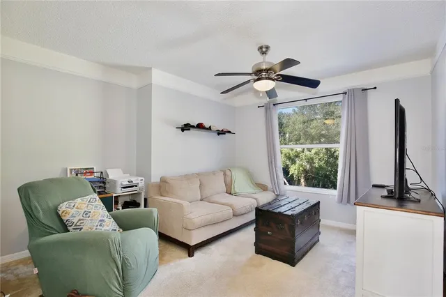 a living room with furniture and a window
