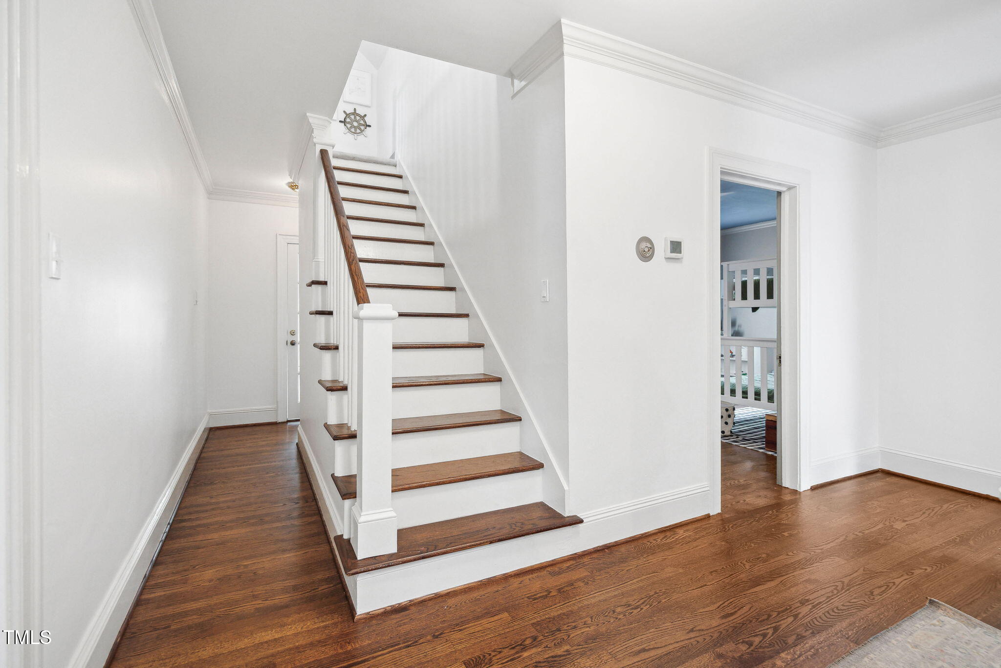 3210 Merriman Avenue Raleigh, NC 27607 - Photo 14 of 43 a view of a hallway with wooden floor and entryway