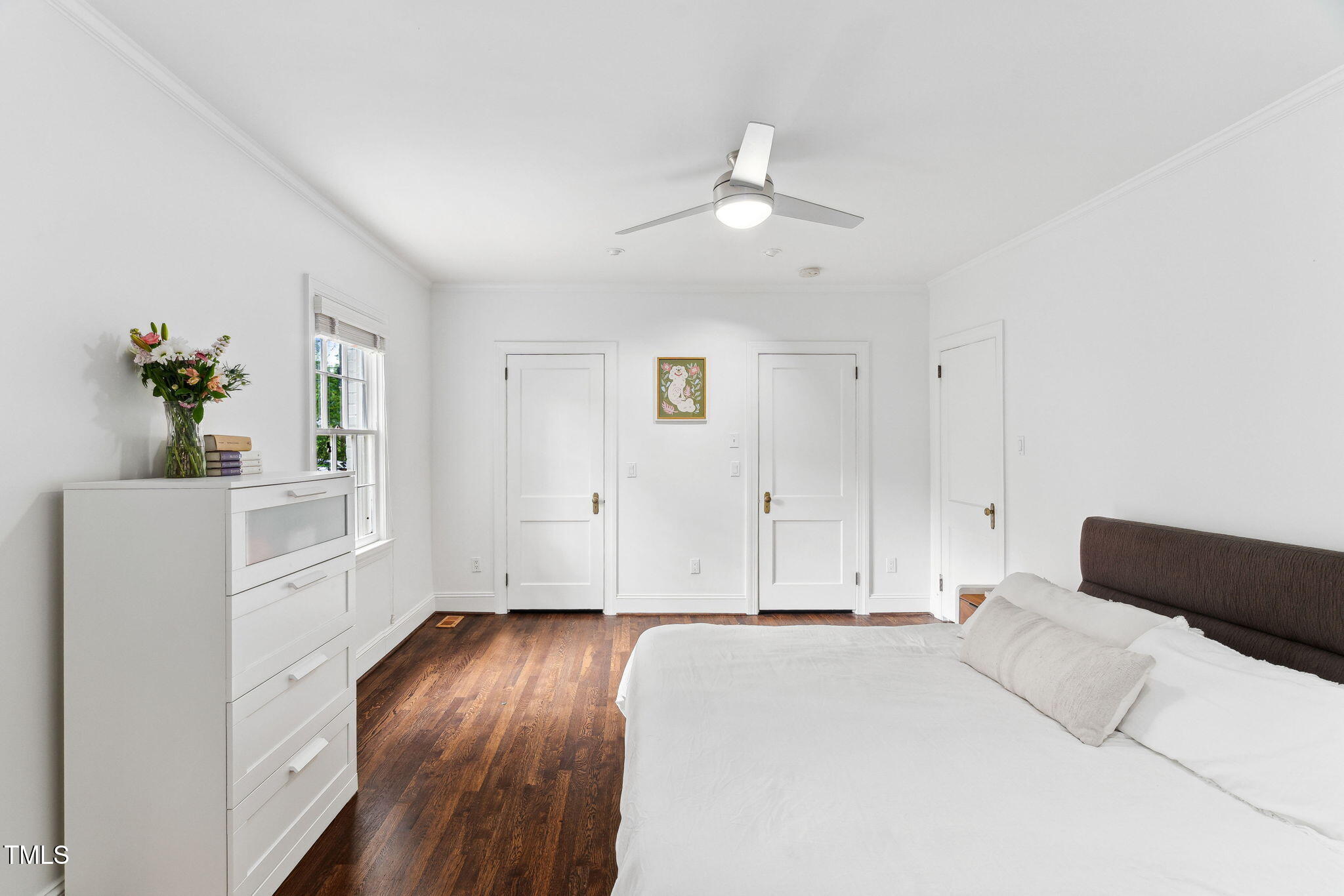 3210 Merriman Avenue Raleigh, NC 27607 - Photo 16 of 43 a bedroom with a bed and wooden floor