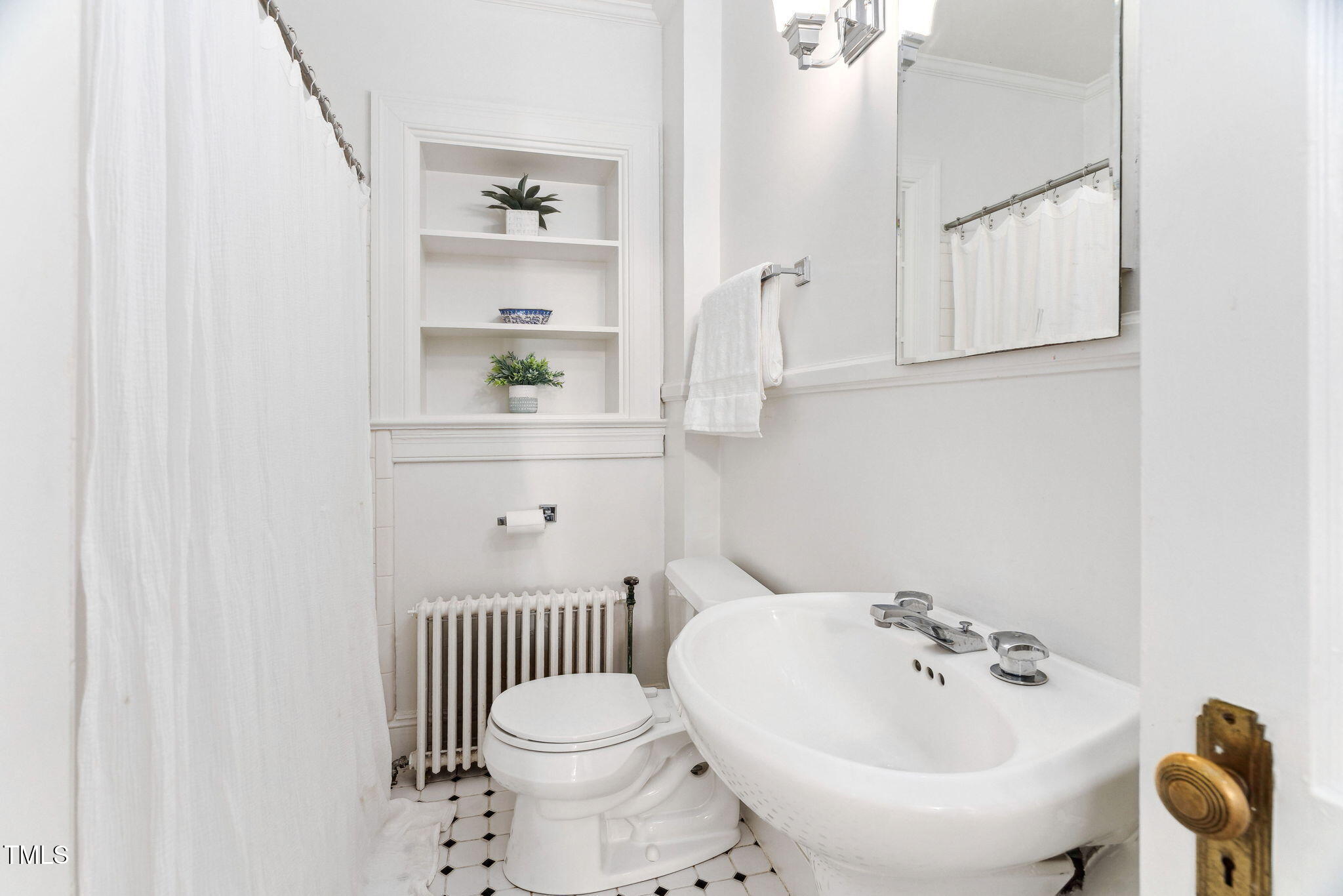 3210 Merriman Avenue Raleigh, NC 27607 - Photo 22 of 43 a bathroom with a sink a toilet and shower