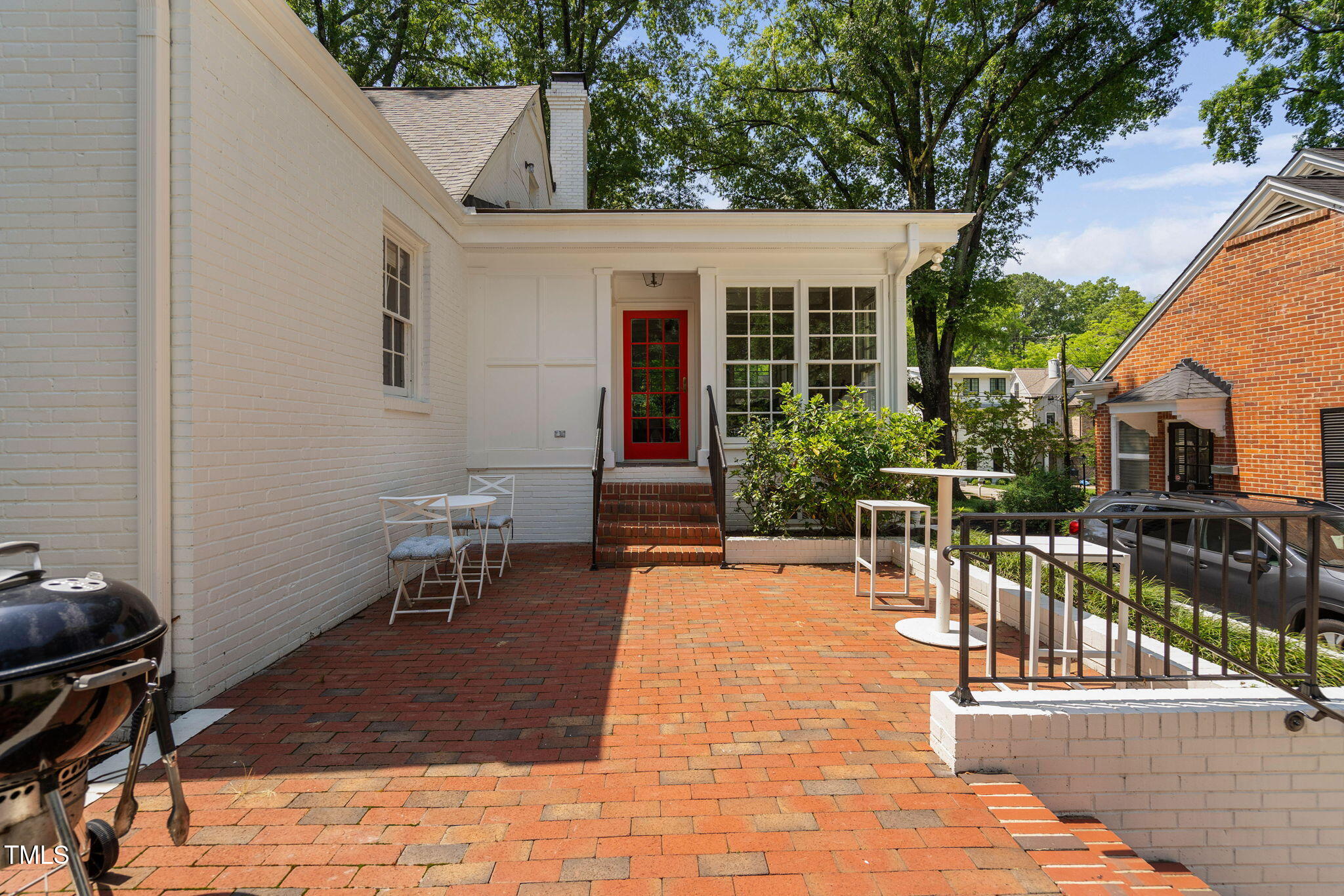 3210 Merriman Avenue Raleigh, NC 27607 - Photo 30 of 43 a view of a patio with table and chairs with wooden floor and fence
