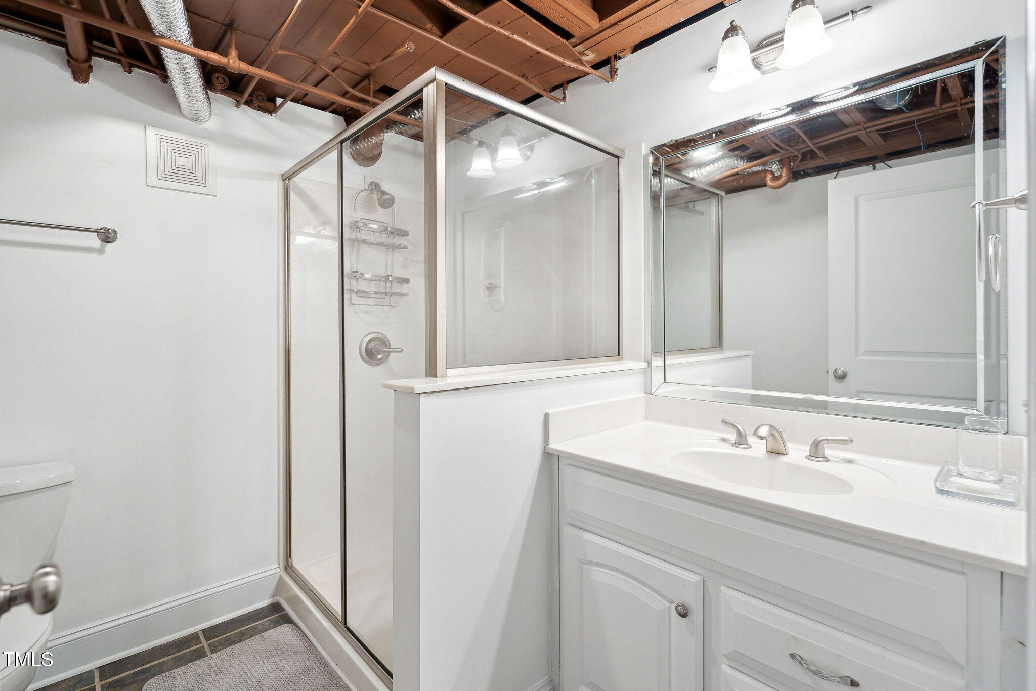 3210 Merriman Avenue Raleigh, NC 27607 - Photo 39 of 43 a bathroom with a sink and a mirror