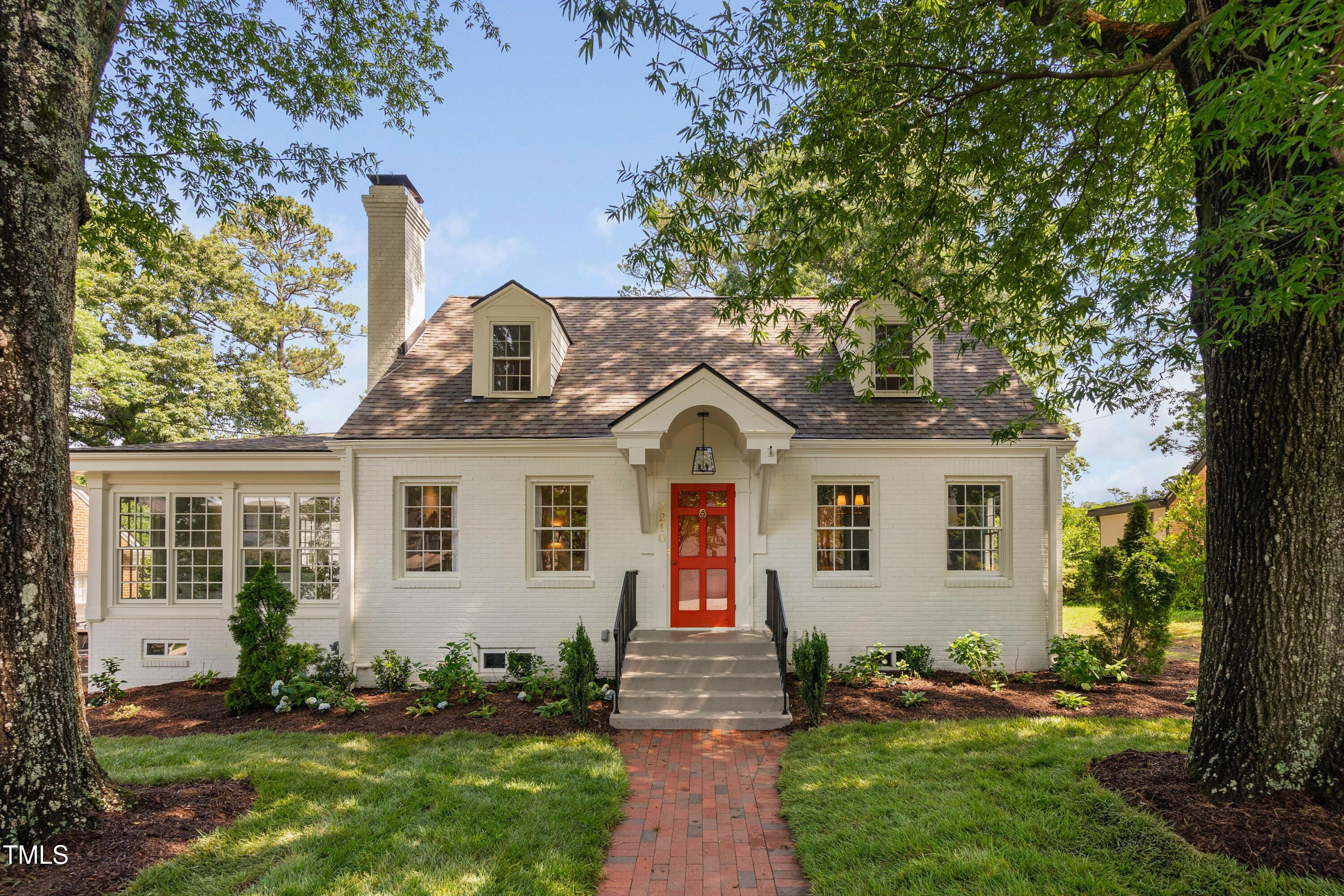 3210 Merriman Avenue Raleigh, NC 27607 - Photo 3 of 43 a front view of a house with a yard