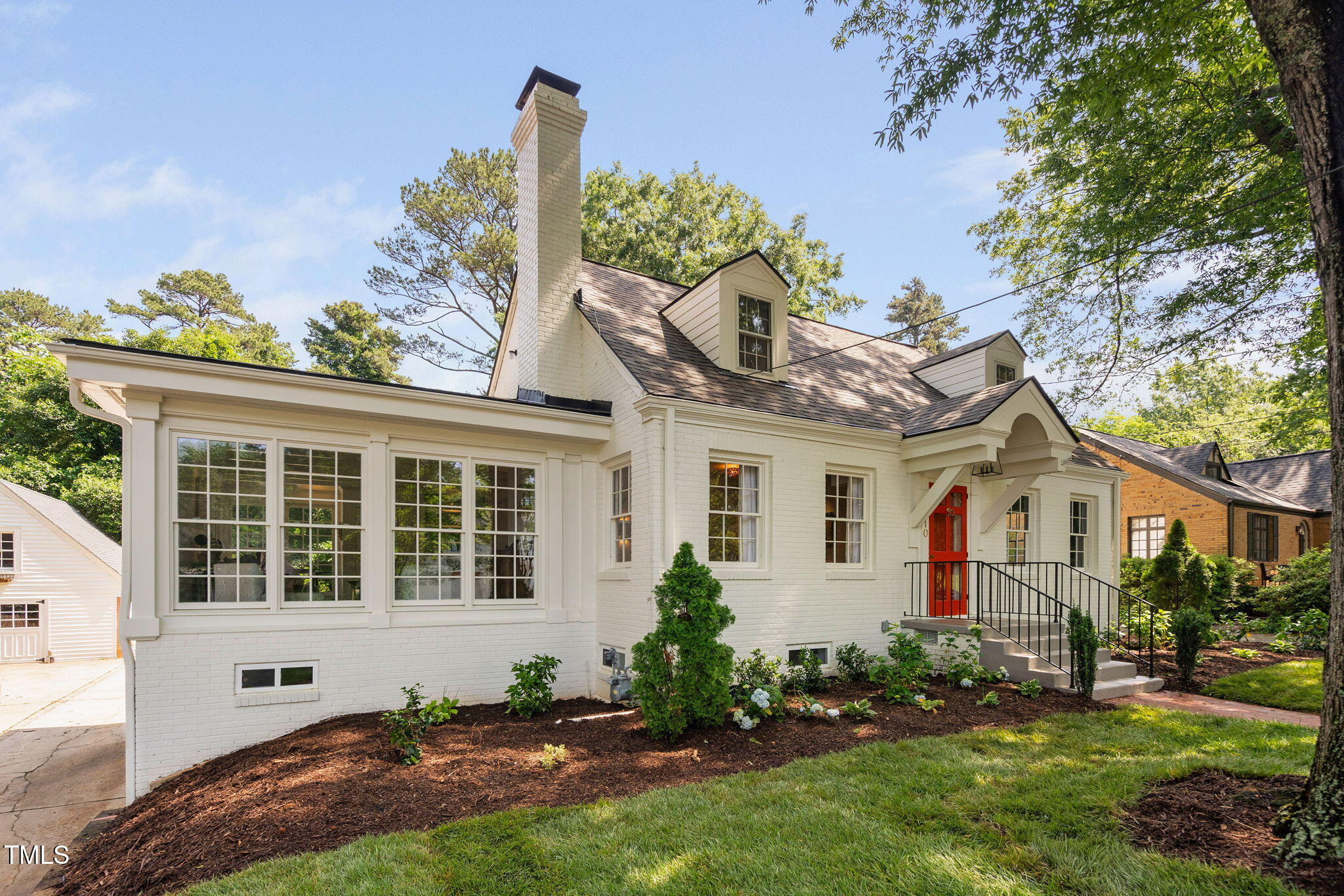 3210 Merriman Avenue Raleigh, NC 27607 - Photo 4 of 43 a front view of a house with a garden and plants