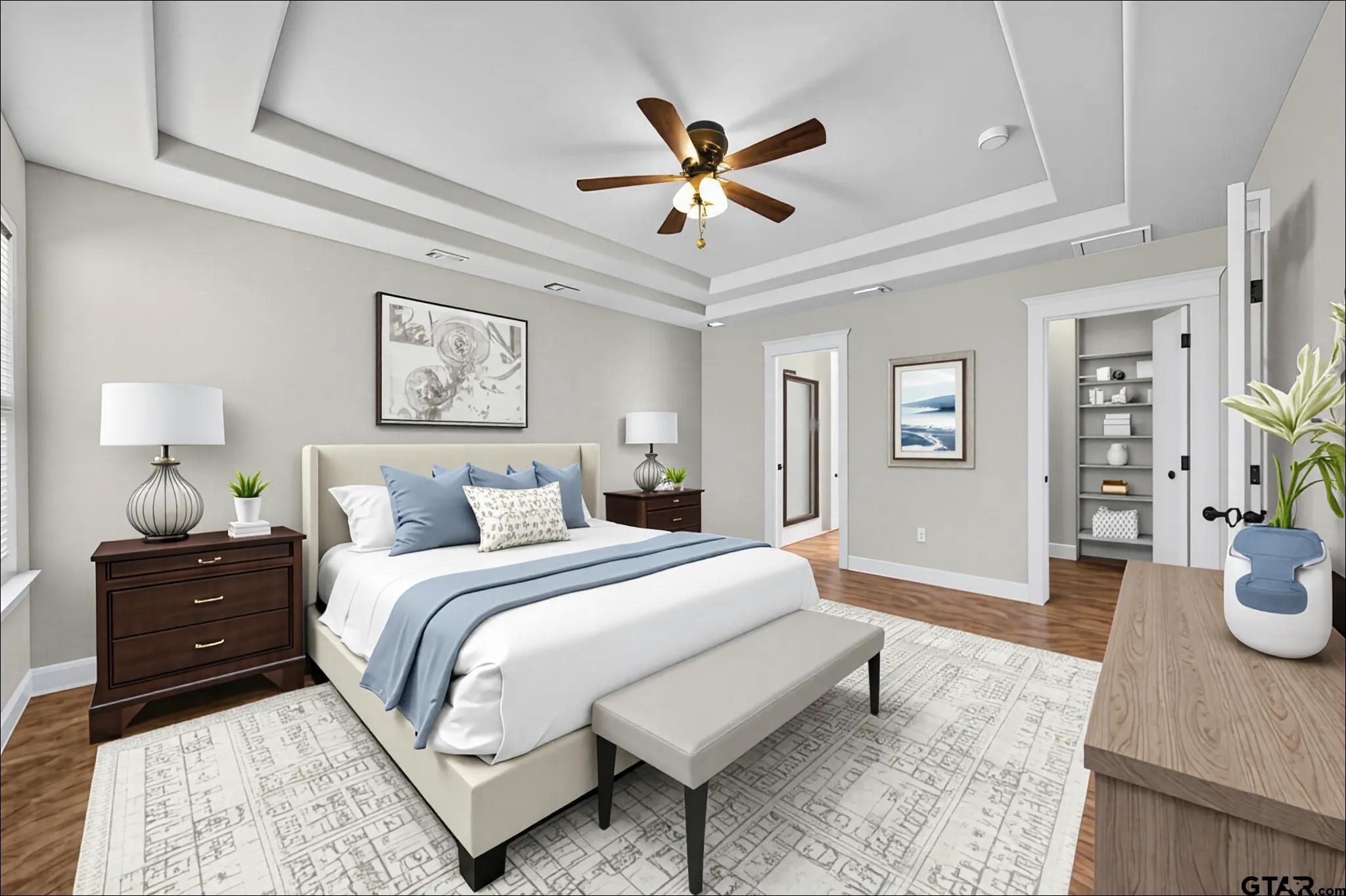 709 Linus Lane Lindale, TX 75771 - Photo 20 of 40 a bed room with a bed and a chandelier