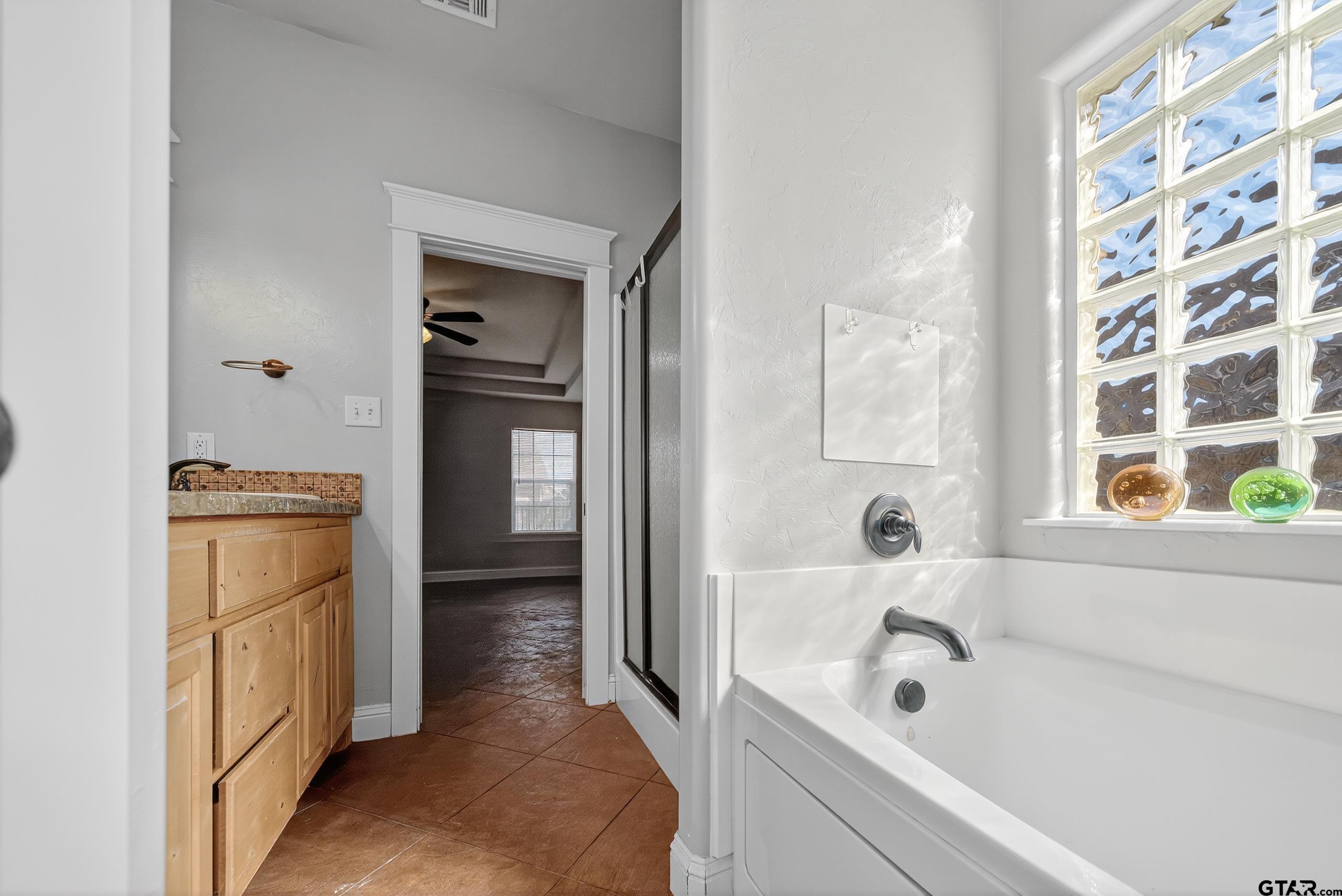 709 Linus Lane Lindale, TX 75771 - Photo 28 of 40 a bathroom with a tub sink and toilet