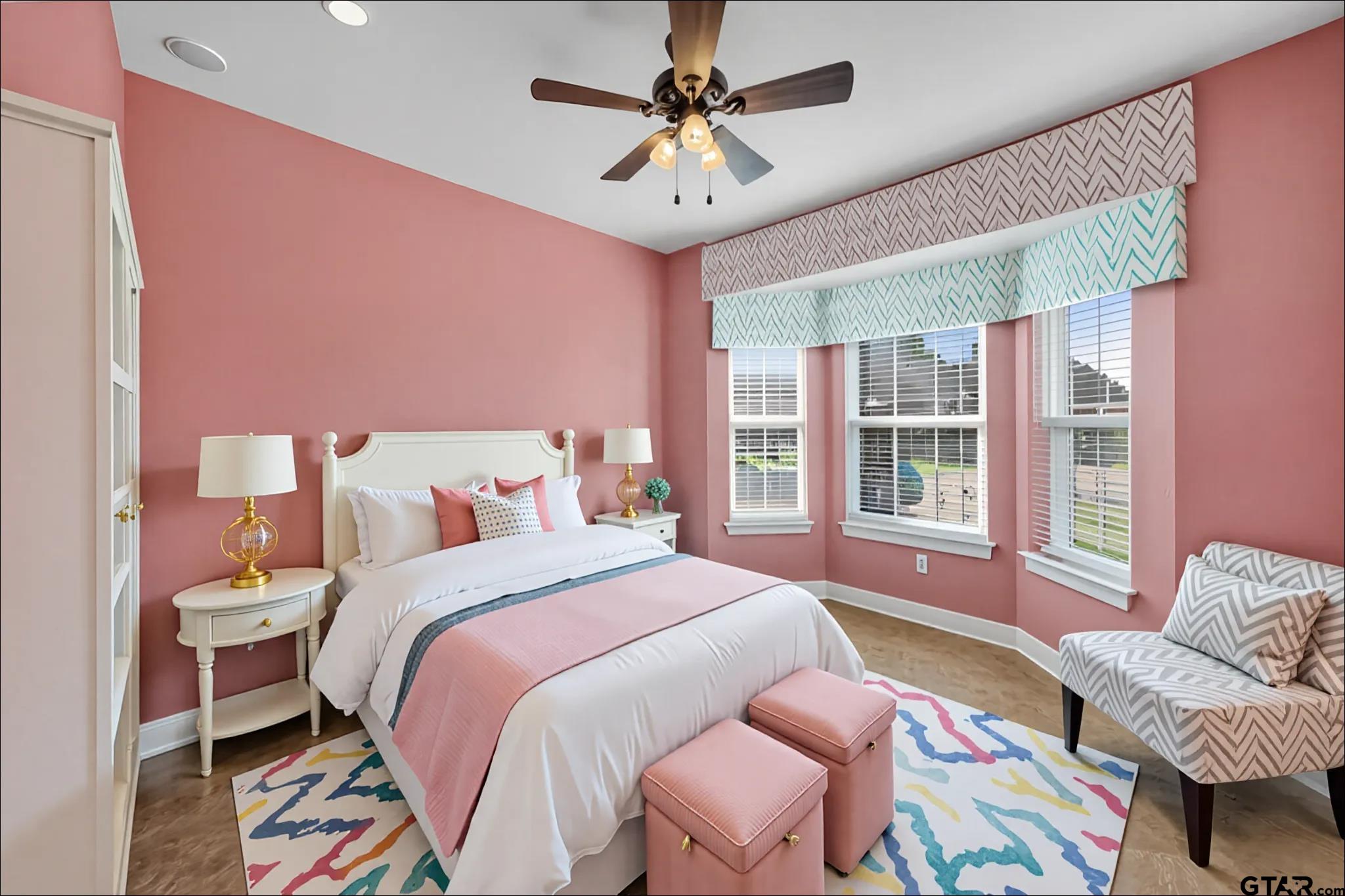 709 Linus Lane Lindale, TX 75771 - Photo 29 of 40 a bedroom with a bed and a chandelier