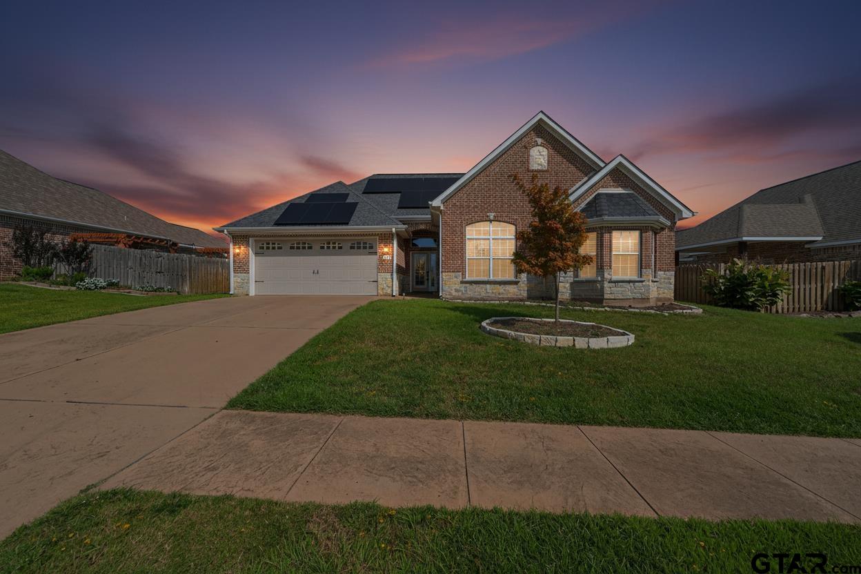 709 Linus Lane Lindale, TX 75771 - Photo 3 of 40 a front view of a house with a yard and garage