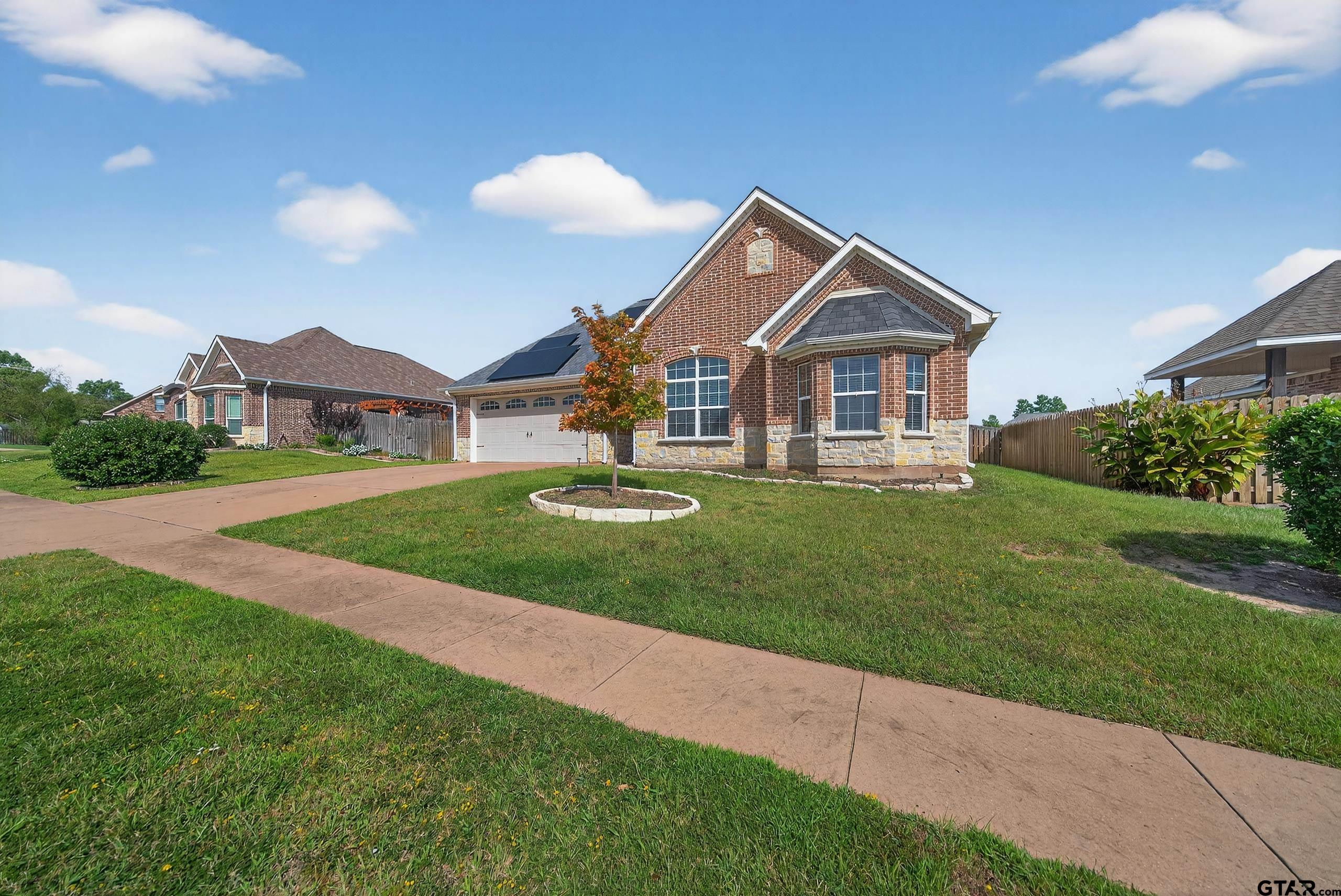709 Linus Lane Lindale, TX 75771 - Photo 39 of 40 a front view of a house with a yard and trees