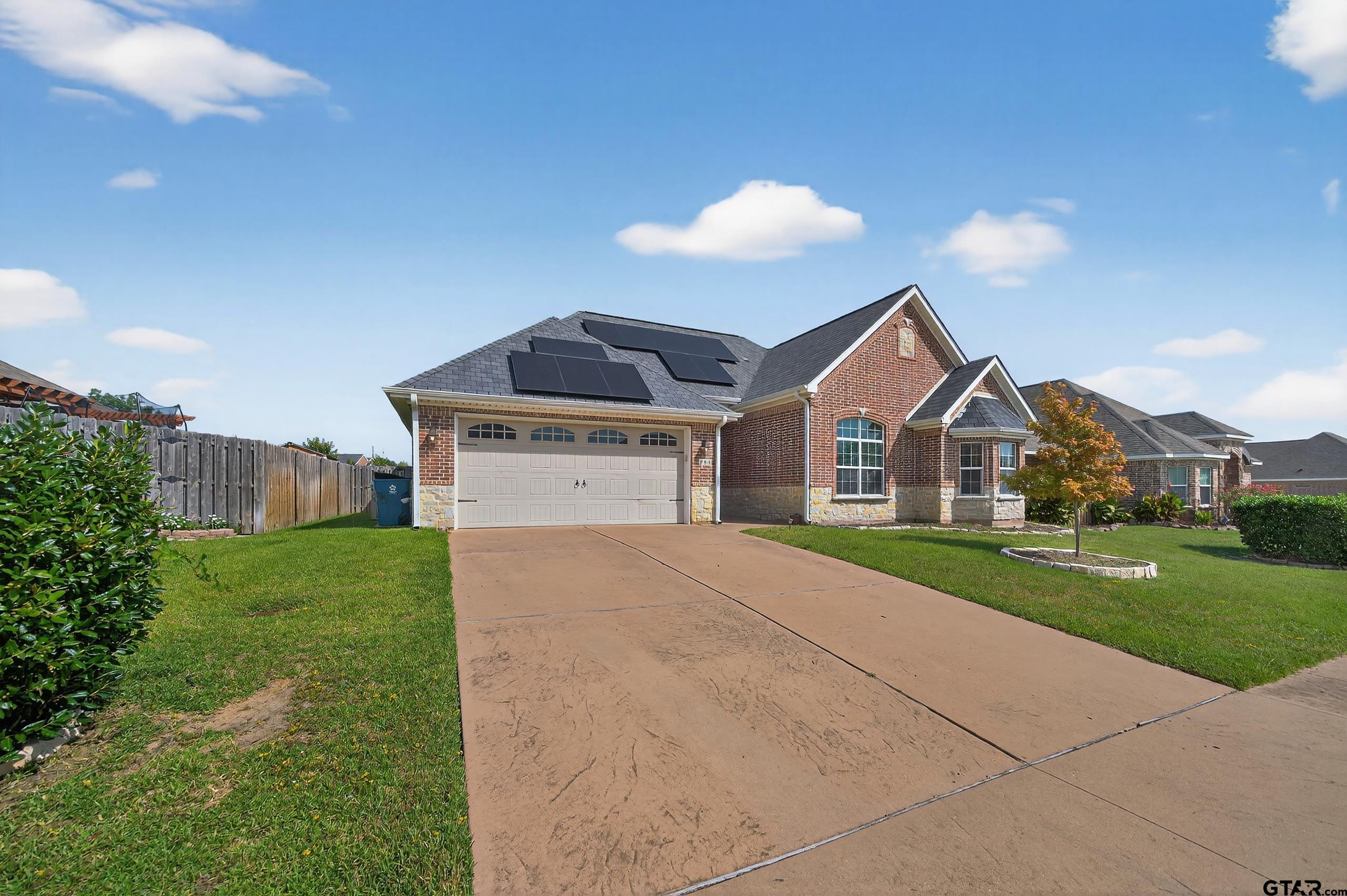 709 Linus Lane Lindale, TX 75771 - Photo 40 of 40 a front view of a house with a yard and garage