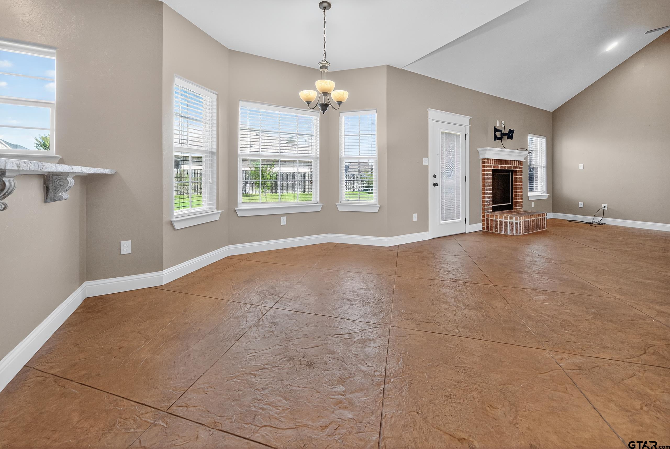 709 Linus Lane Lindale, TX 75771 - Photo 6 of 40 a view of a room with window and fireplace