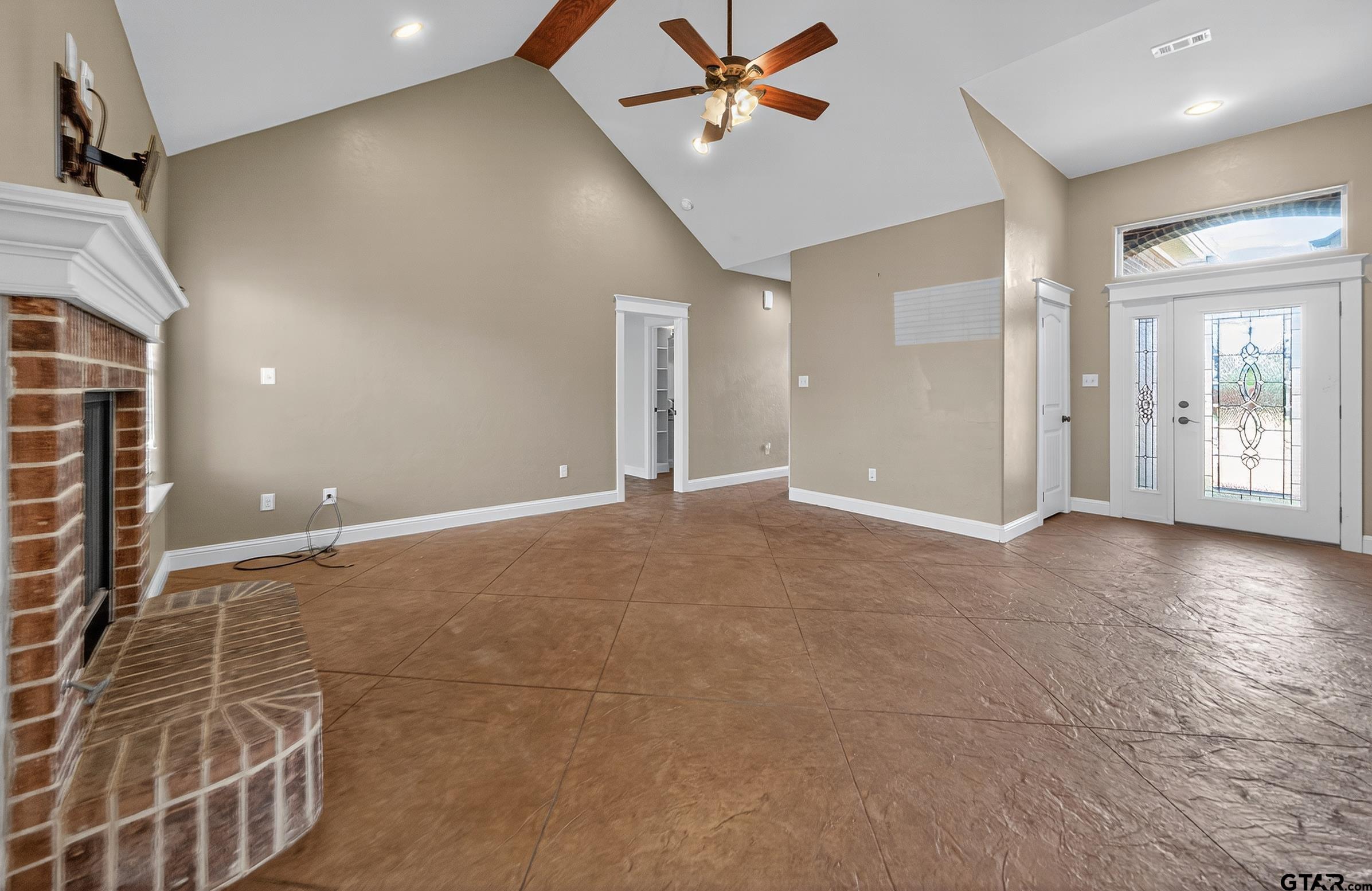 709 Linus Lane Lindale, TX 75771 - Photo 8 of 40 a view of a livingroom with a ceiling fan & window