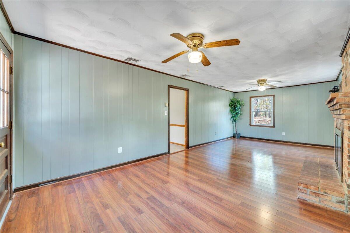 2216 East Ruritan Road Roanoke, VA 24012 - Photo 20 of 57 a view of an empty room with window and wooden floor