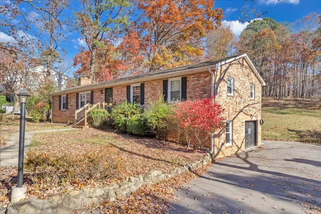 a large house with a large tree in front of it
