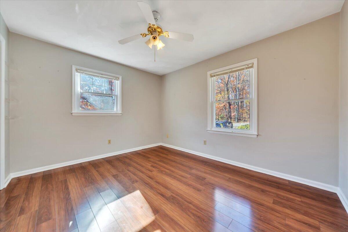 2216 East Ruritan Road Roanoke, VA 24012 - Photo 31 of 57 a view of empty room with wooden floor and fan