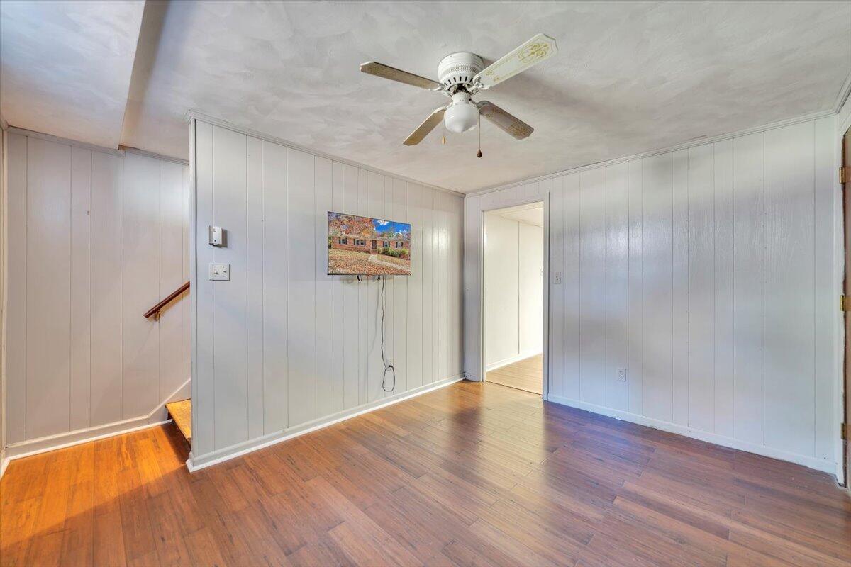 2216 East Ruritan Road Roanoke, VA 24012 - Photo 36 of 57 an empty room with wooden floor fan and windows