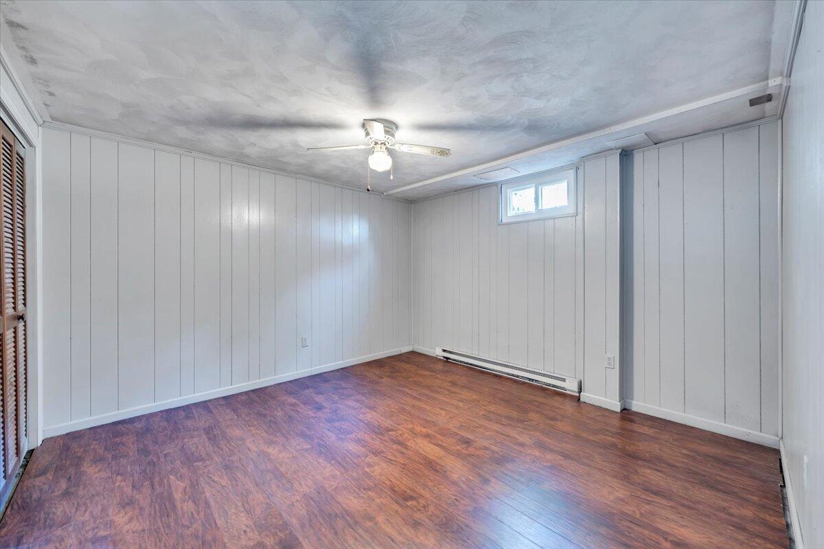 2216 East Ruritan Road Roanoke, VA 24012 - Photo 38 of 57 a view of an empty room with wooden floor