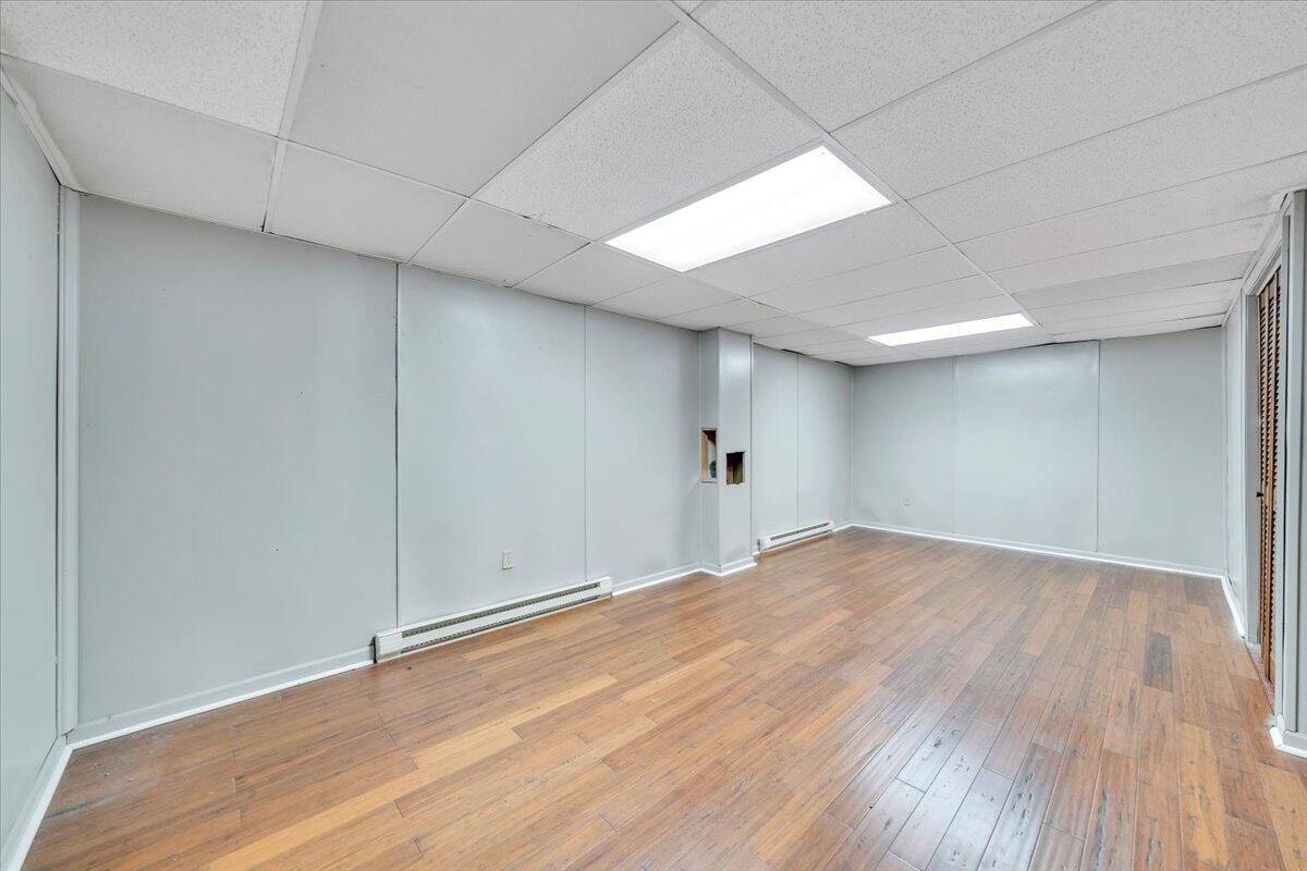2216 East Ruritan Road Roanoke, VA 24012 - Photo 40 of 57 a view of empty room with wooden floor