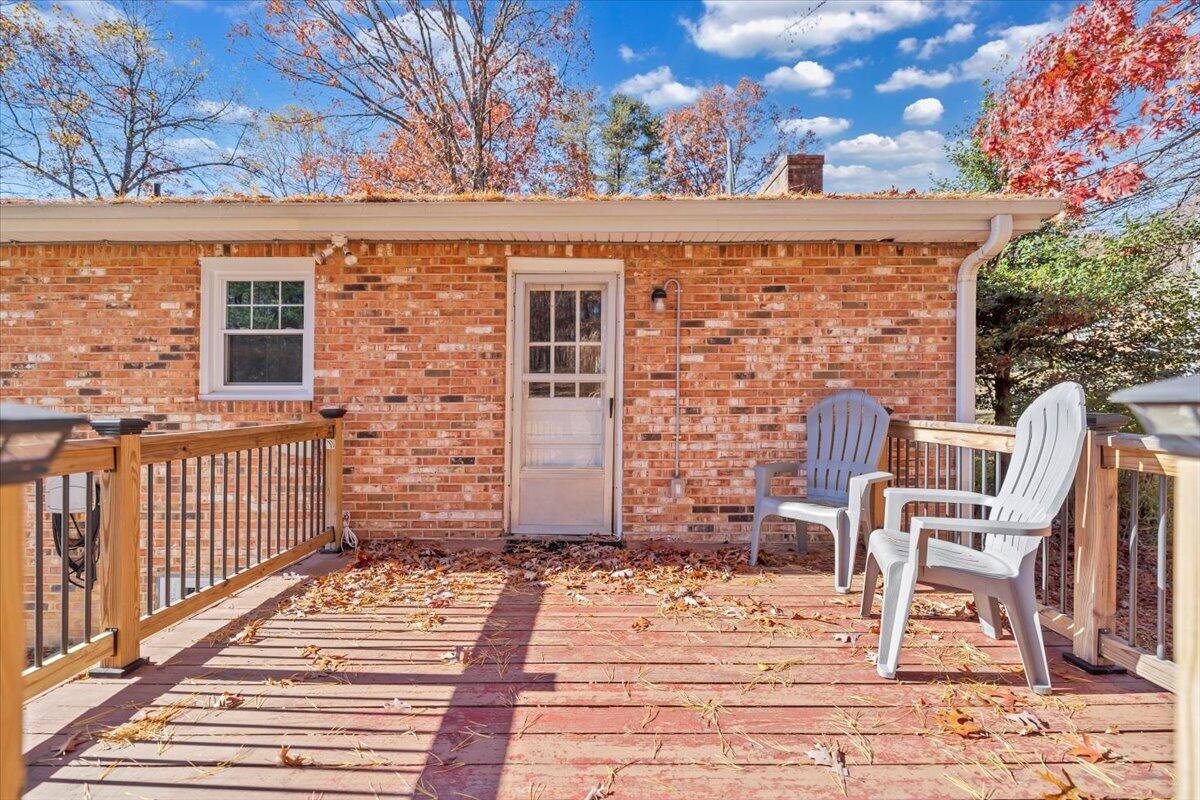 2216 East Ruritan Road Roanoke, VA 24012 - Photo 4 of 57 a view of a patio with a chair and table