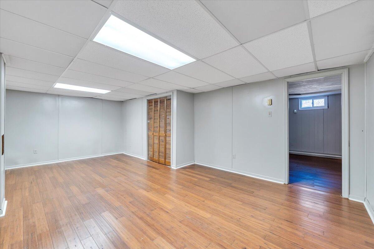 2216 East Ruritan Road Roanoke, VA 24012 - Photo 42 of 57 a view of an empty room with wooden floor